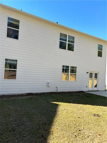 a house view with a backyard space