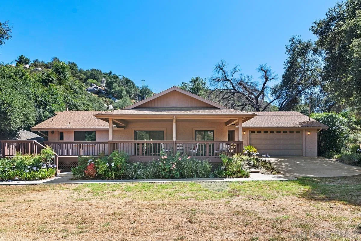 17230 Highway 67 Ramona, CA 92065 - Photo 1 of 37 a front view of a house with a garden