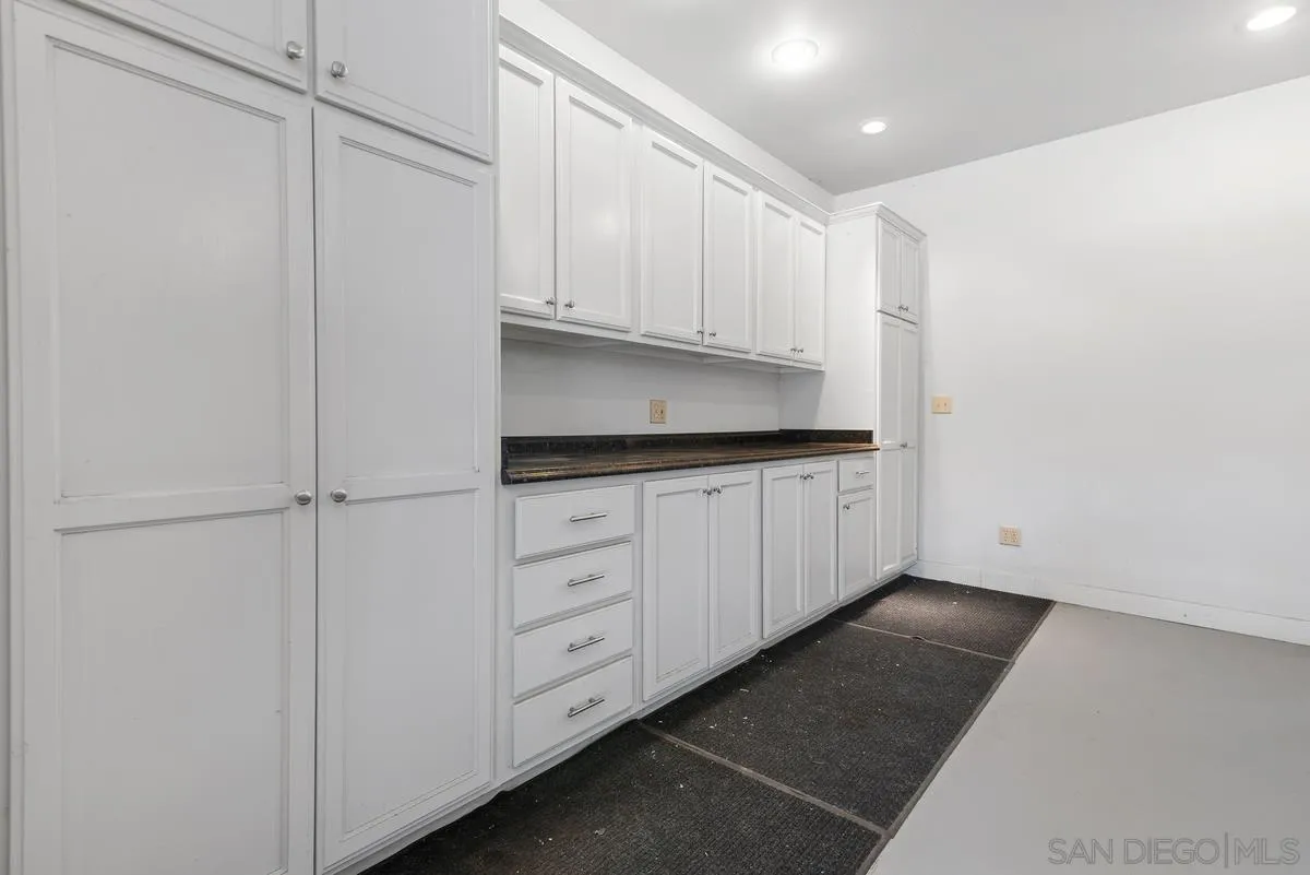 17230 Highway 67 Ramona, CA 92065 - Photo 26 of 37 a kitchen with white cabinets and white appliances