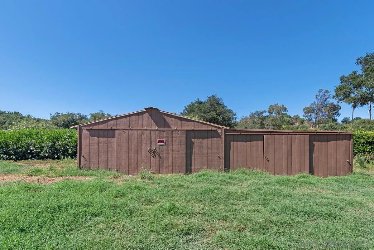 17230 Highway 67 Ramona, CA 92065 - Photo 31 of 37 a view of backyard with potted plants and wooden fence