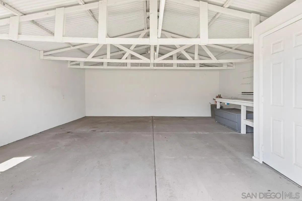 17230 Highway 67 Ramona, CA 92065 - Photo 32 of 37 a view of a garage with racks on the wall