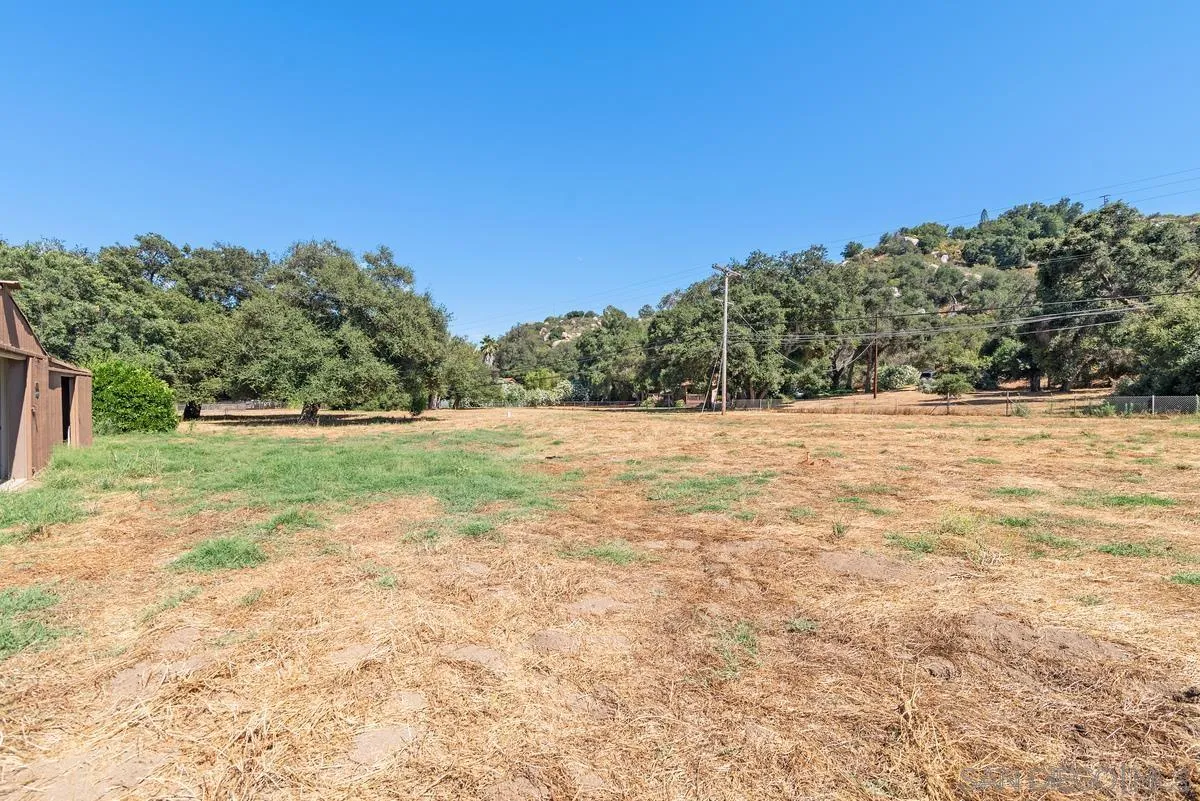 17230 Highway 67 Ramona, CA 92065 - Photo 34 of 37 a view of a field with trees in the background