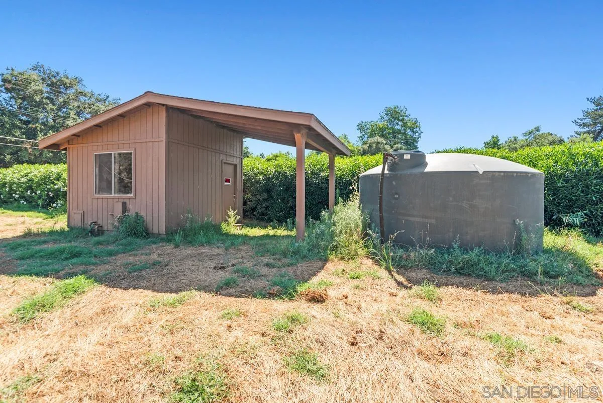 17230 Highway 67 Ramona, CA 92065 - Photo 35 of 37 a backyard of a house with plants and trees