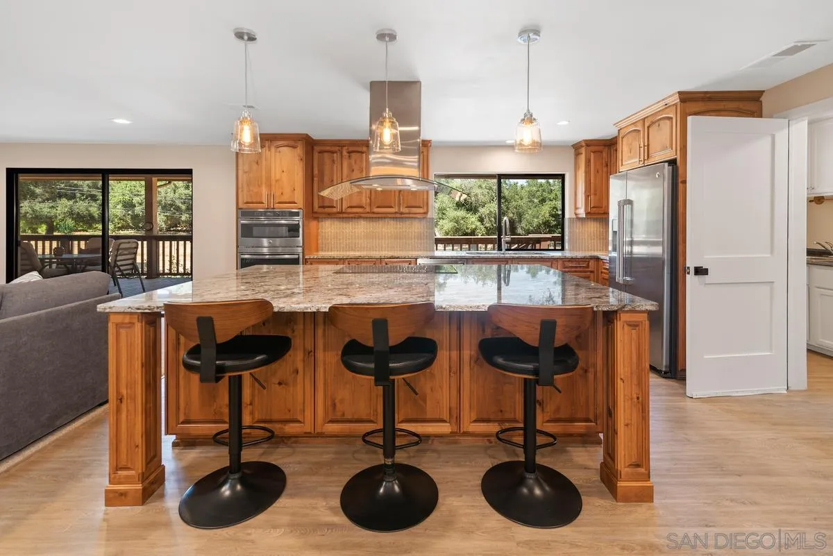 17230 Highway 67 Ramona, CA 92065 - Photo 10 of 37 a kitchen with stainless steel appliances granite countertop a sink and cabinets