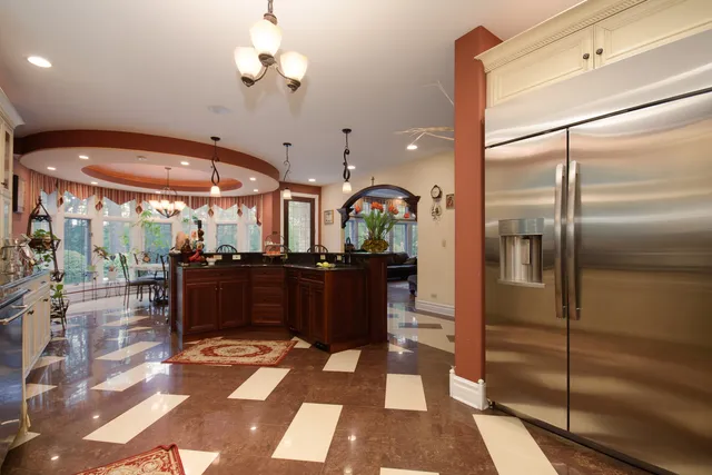 a kitchen with a refrigerator and a sink