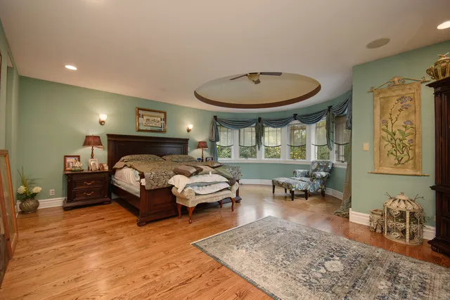 a bedroom with furniture and a chandelier