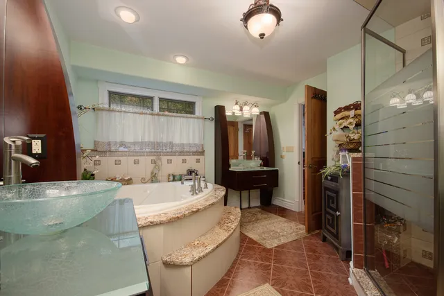 a bathroom with a bathtub sink and toilet