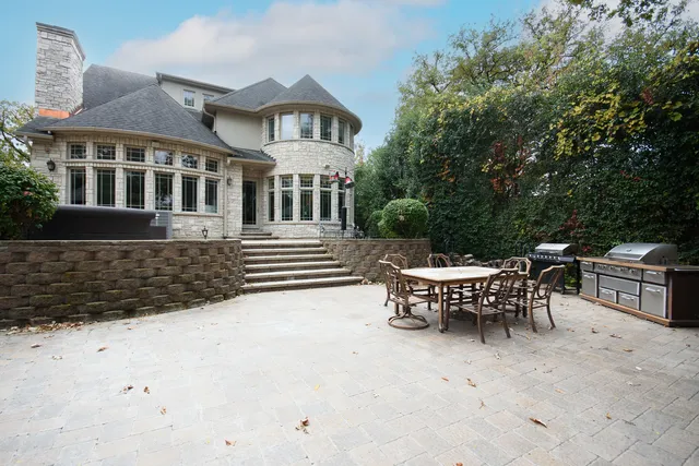 a view of a patio with a table and chairs