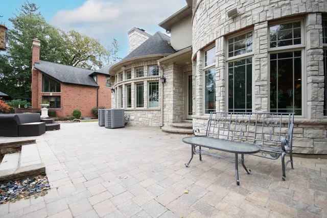 a view of a patio with a table and chairs