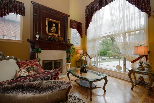 a living room with furniture and a fireplace