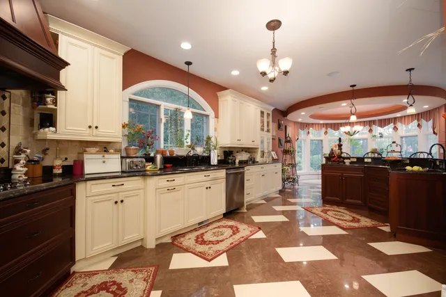 a large kitchen with granite countertop lots of counter top space