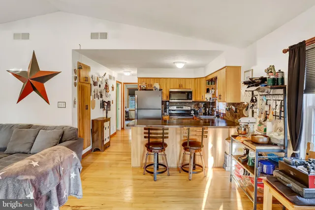 a white toilet sitting next to a bathroom sink