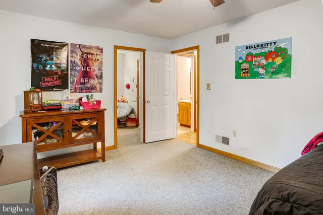 a bedroom with bed and a couch