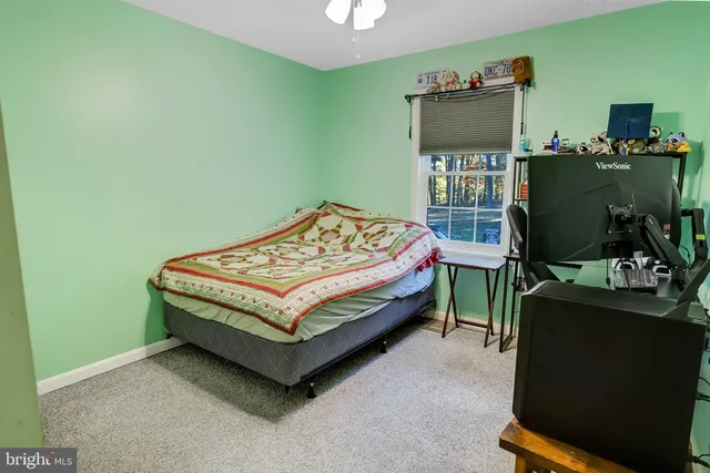 a bathroom with a sink and a refrigerator
