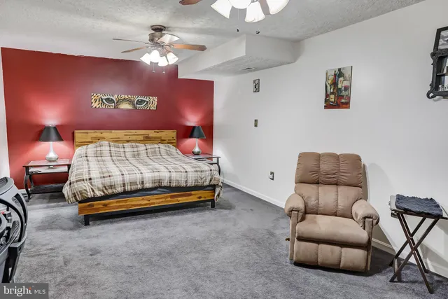 a view of a storage room with furniture and a window