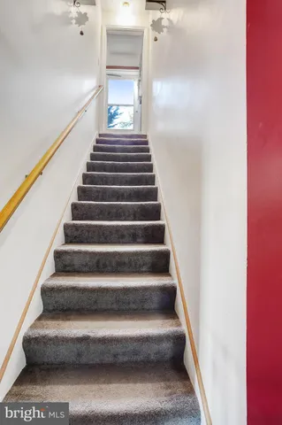 a view of a backyard with table and chairs and a fire pit