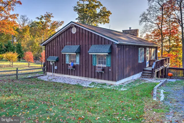 a view of a patio with a table and chairs