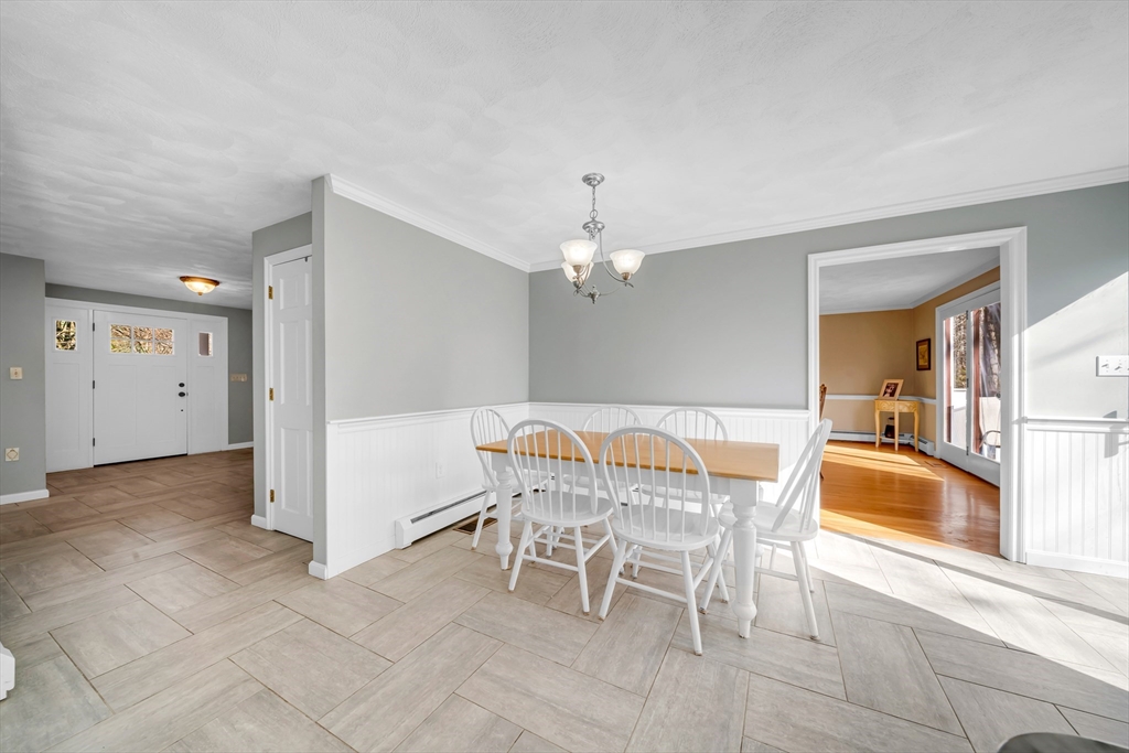 315 Candlestick Road North Andover, MA 01845 - Photo 14 of 42 a dining room with furniture and chandelier