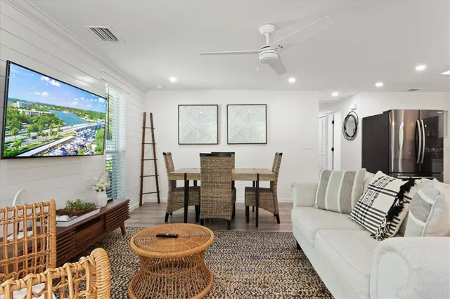 a view of swimming pool with a table and chairs