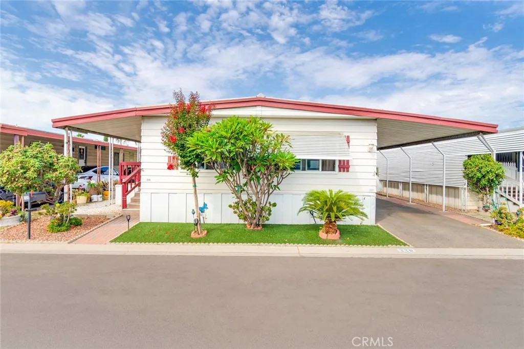 4000 Pierce Street, Unit 220 Riverside, CA 92505 - Photo 1 of 30 a backyard of a house with lots of green space and outdoor seating