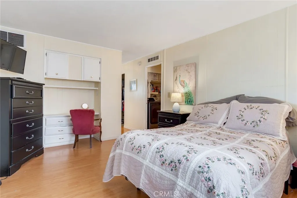 4000 Pierce Street, Unit 220 Riverside, CA 92505 - Photo 16 of 30 a bedroom with a bed and furniture