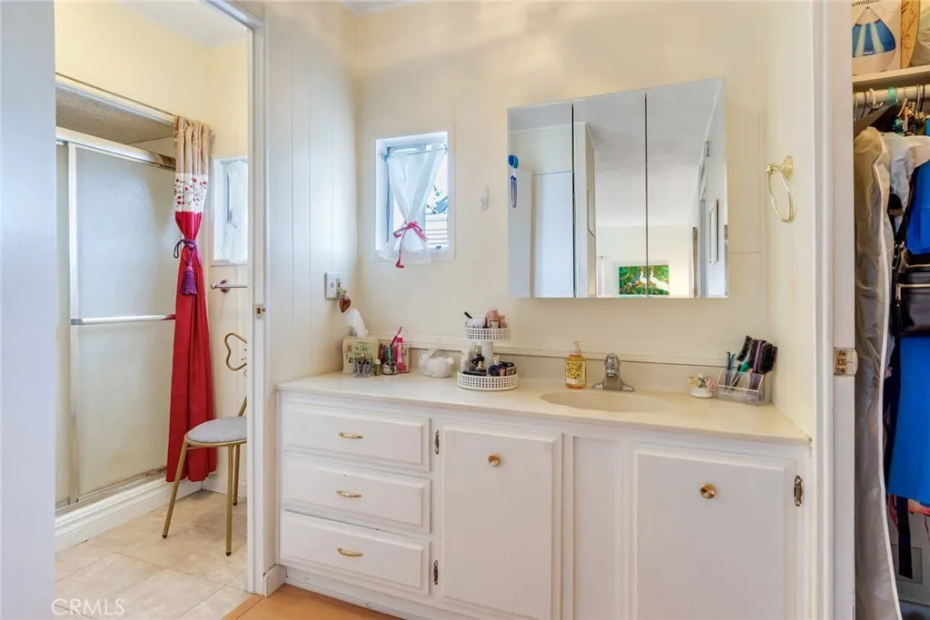 4000 Pierce Street, Unit 220 Riverside, CA 92505 - Photo 17 of 30 a bathroom with a double vanity sink and a mirror