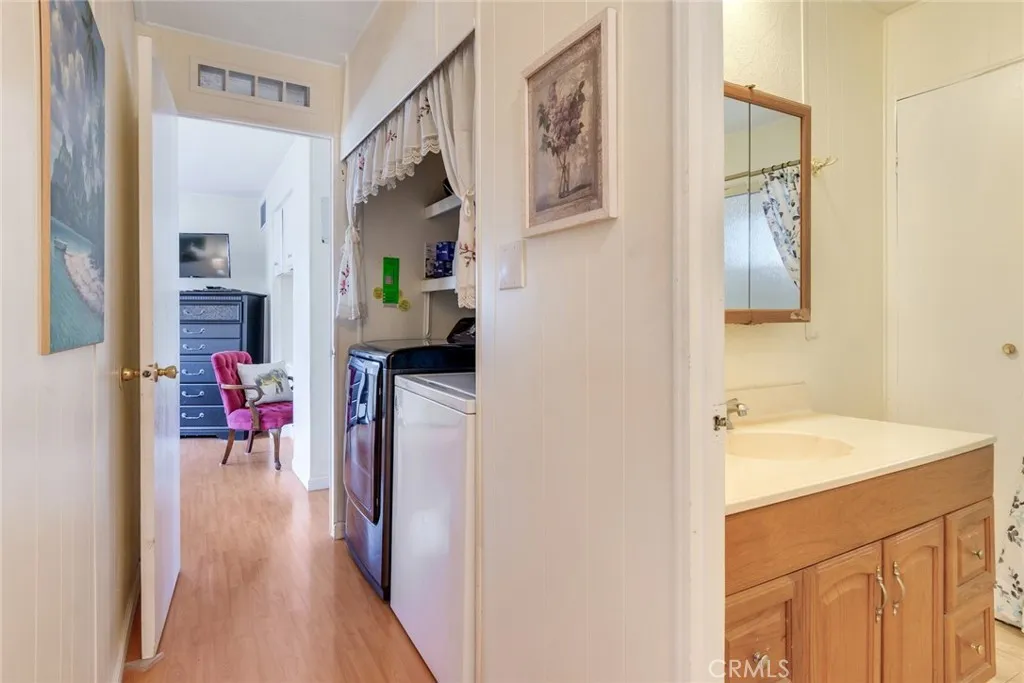 4000 Pierce Street, Unit 220 Riverside, CA 92505 - Photo 19 of 30 a en suite bathroom with a sink and a large mirror