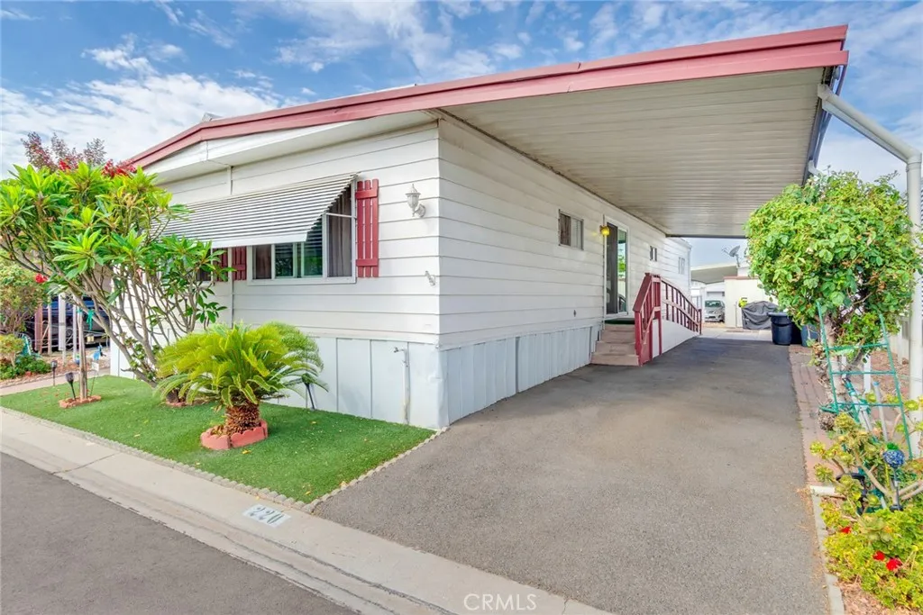 4000 Pierce Street, Unit 220 Riverside, CA 92505 - Photo 2 of 30 a view of a house with a backyard and a garage