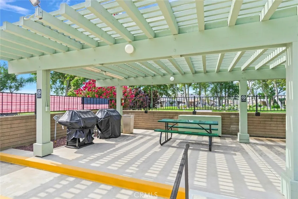 4000 Pierce Street, Unit 220 Riverside, CA 92505 - Photo 24 of 30 a view of a swimming pool with a patio