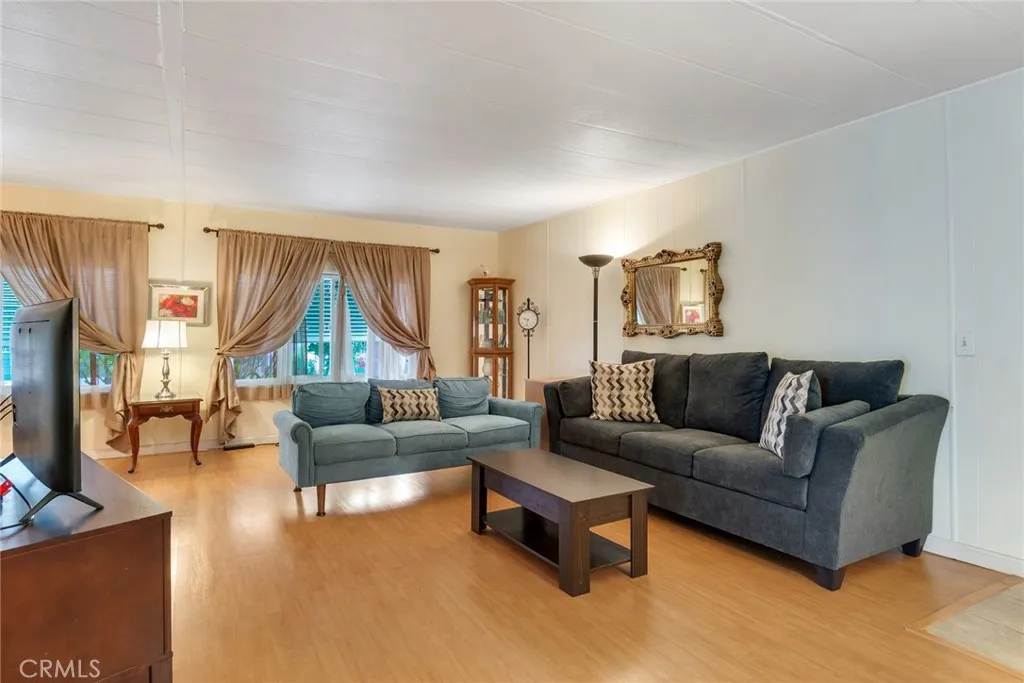 4000 Pierce Street, Unit 220 Riverside, CA 92505 - Photo 5 of 30 a living room with furniture and a large window