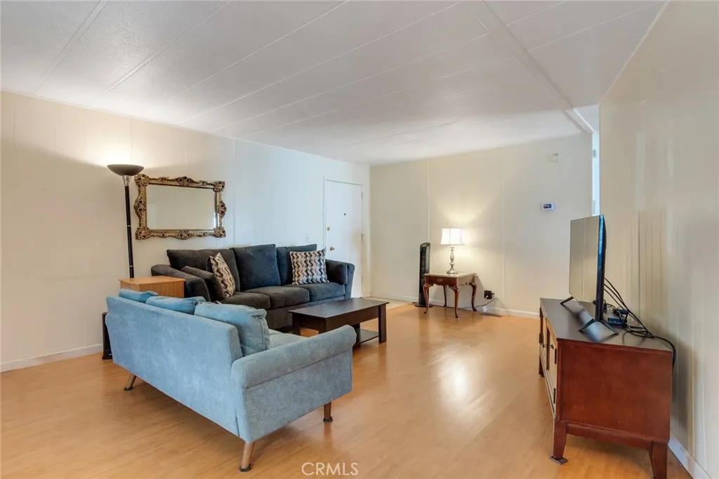 4000 Pierce Street, Unit 220 Riverside, CA 92505 - Photo 6 of 30 a living room with furniture and a table