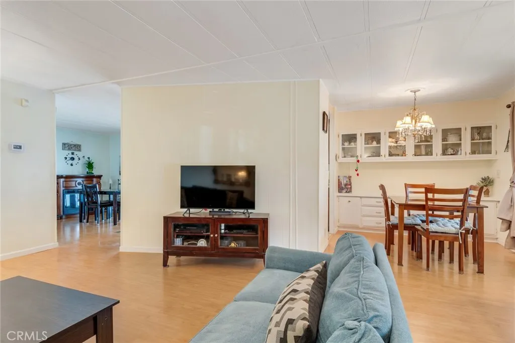 4000 Pierce Street, Unit 220 Riverside, CA 92505 - Photo 7 of 30 a living room with furniture and a flat screen tv