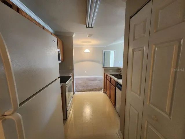 a view of kitchen and utility room