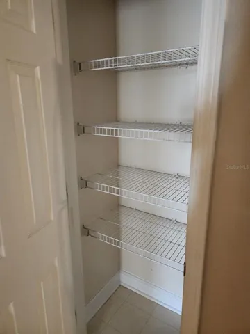 a bathroom with a white cabinet