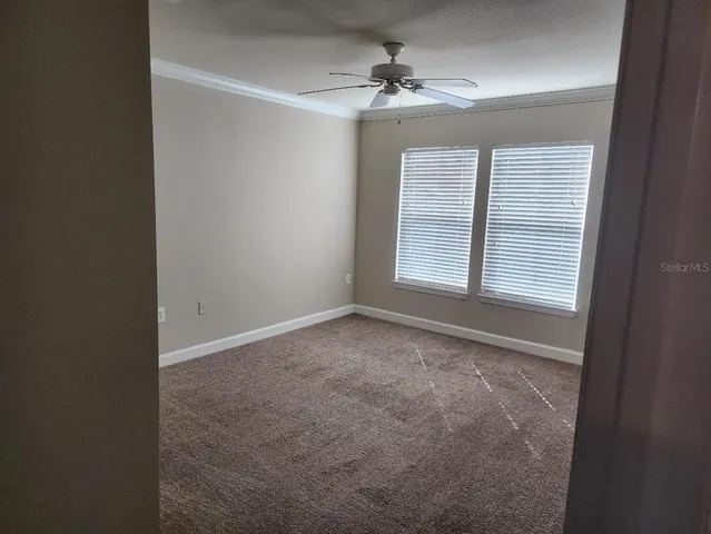 a view of an empty room with a window