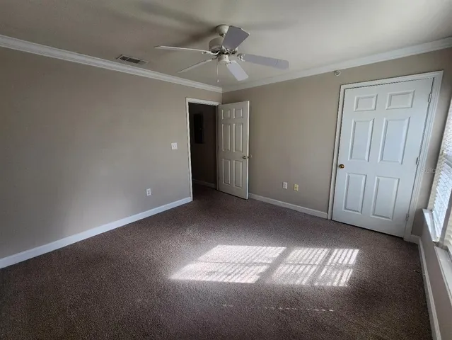 a view of a room with a hallway