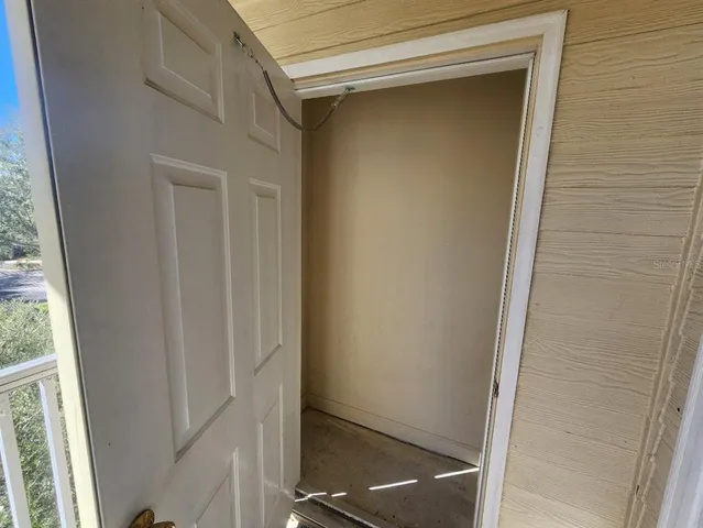 a view of a balcony with wooden floor