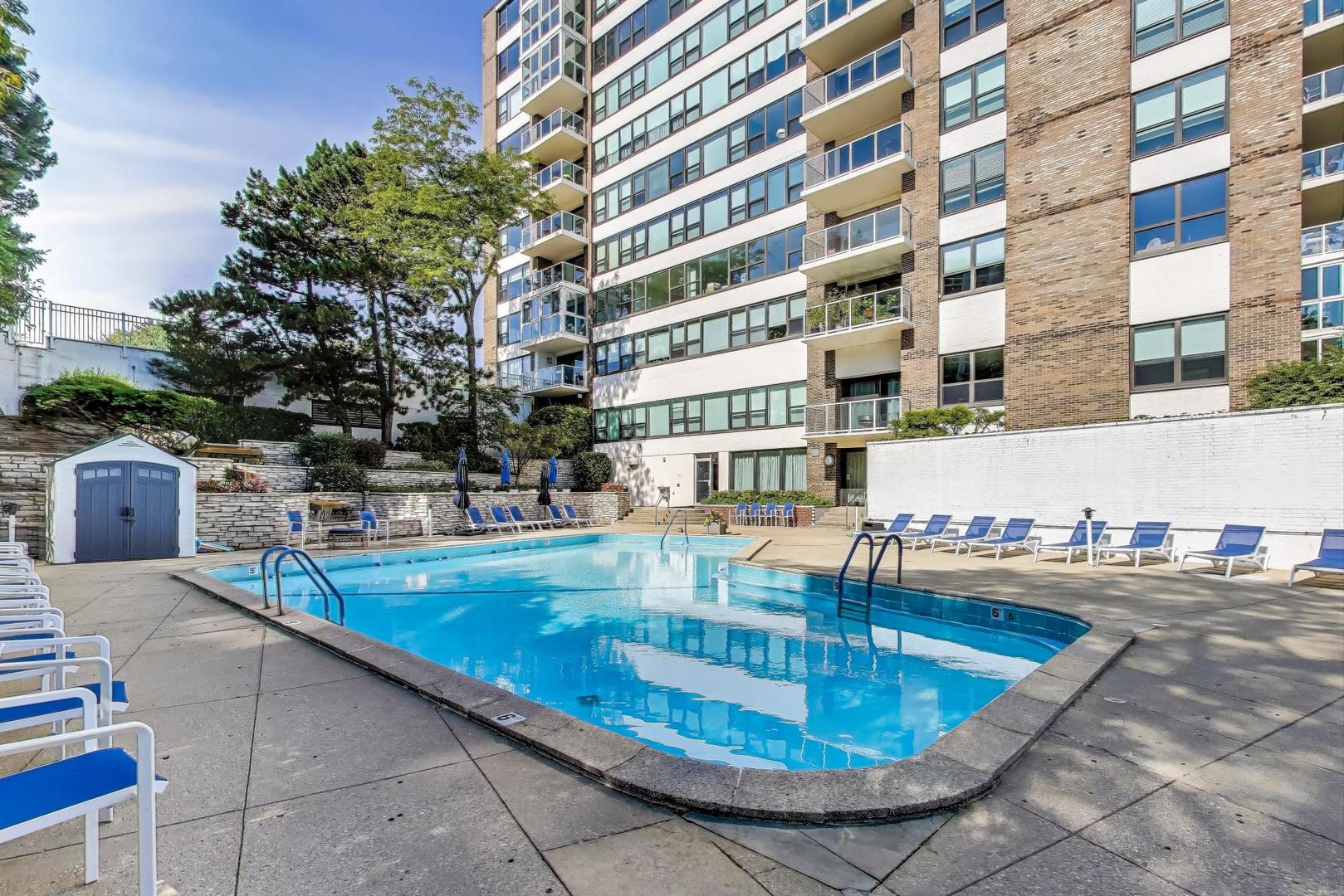 1616 Sheridan Road, Unit 9H Wilmette, IL 60091 - Photo 23 of 28 a view of a swimming pool with a lounge chairs