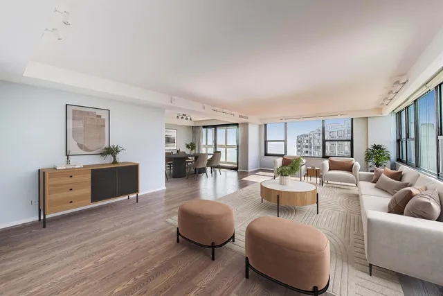 a living room with furniture or couch and a wooden floor