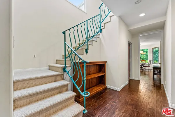 a view of entryway wooden floor and stairs