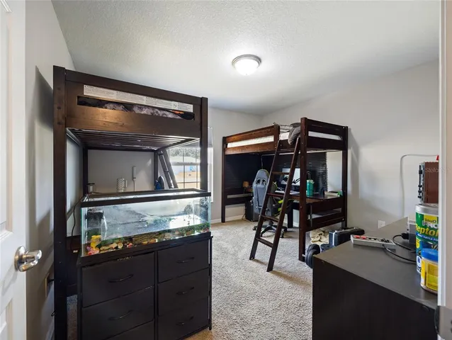 a bedroom with bed and a dresser