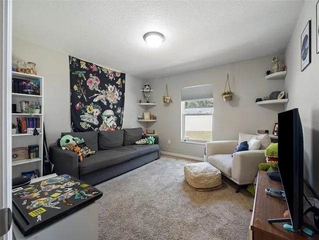 a living room with furniture and a window