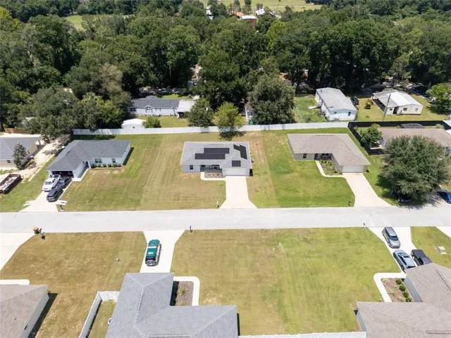an aerial view of a house with swimming pool