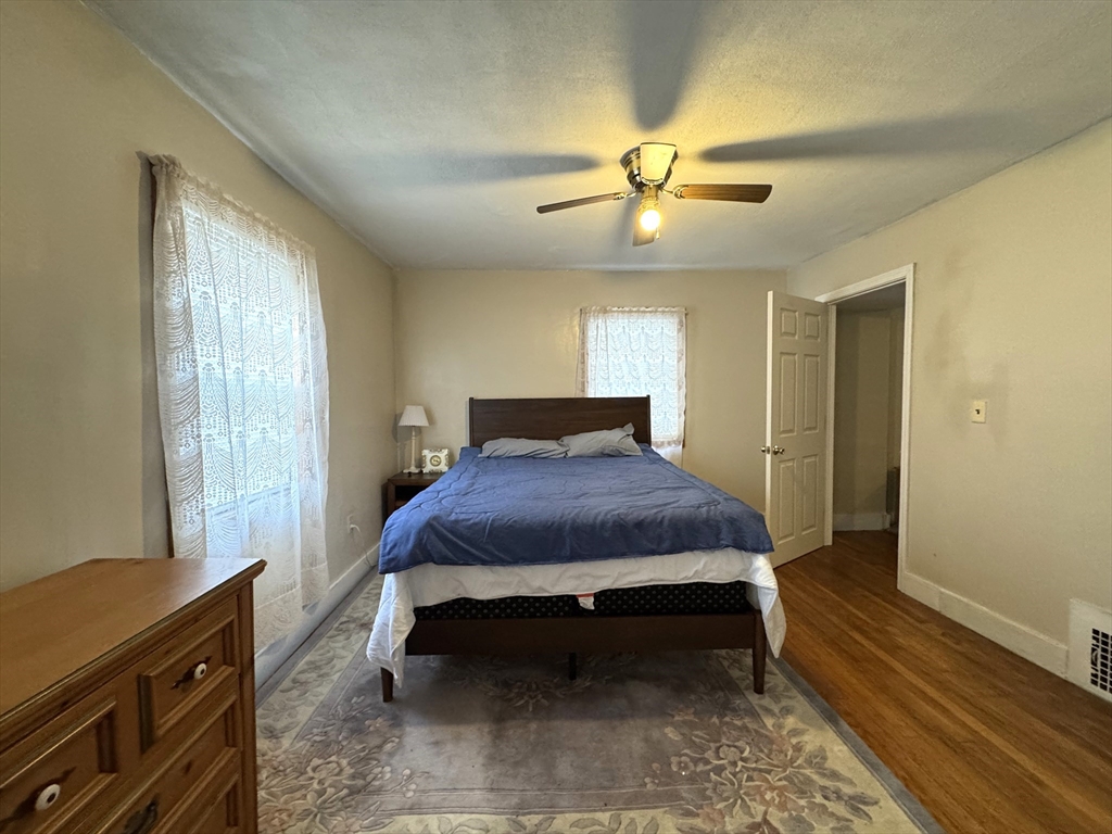 30 Thorpe Street, Unit 2 Somerville, MA 02143 - Photo 3 of 9 a spacious bedroom with a bed and a window