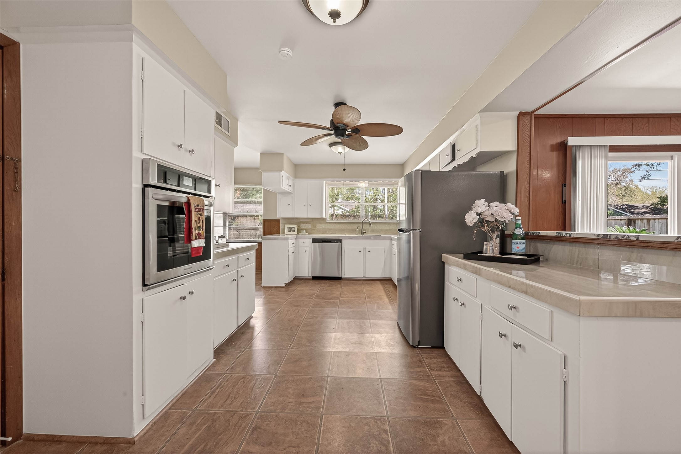 5646 Hazen Street Houston, TX 77081 - Photo 18 of 43 This spacious, bright kitchen features brand-new stainless steel appliances with fresh white cabinetry offering an ample amount of storage space.