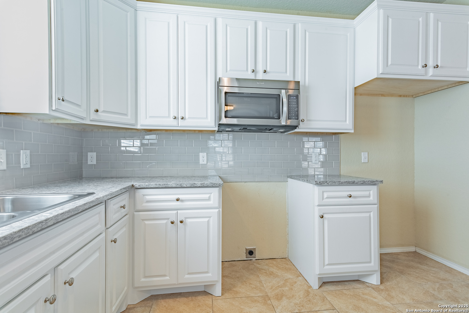 7710 Paraiso Haven Boerne, TX 78015 - Photo 11 of 29 a kitchen with white cabinets and sink