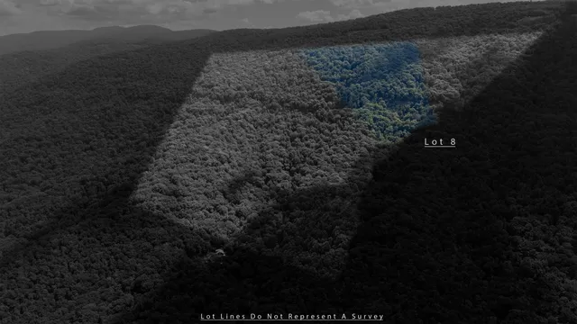 a view of a house with a yard balcony and sitting area