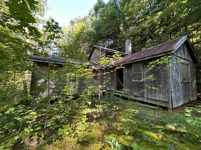 a sign broad in the middle of a field