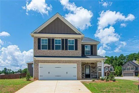 front view of a house with a yard