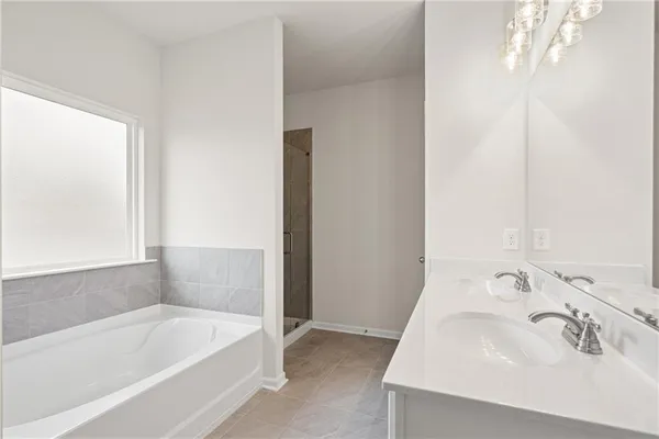 a bathroom with a bathtub and a sink